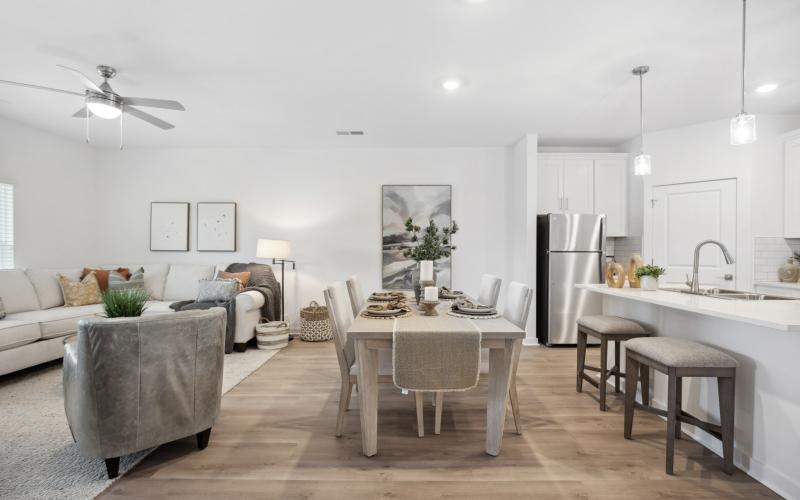 a kitchen with a table and chairs