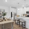 Living room and kitchen with dining table