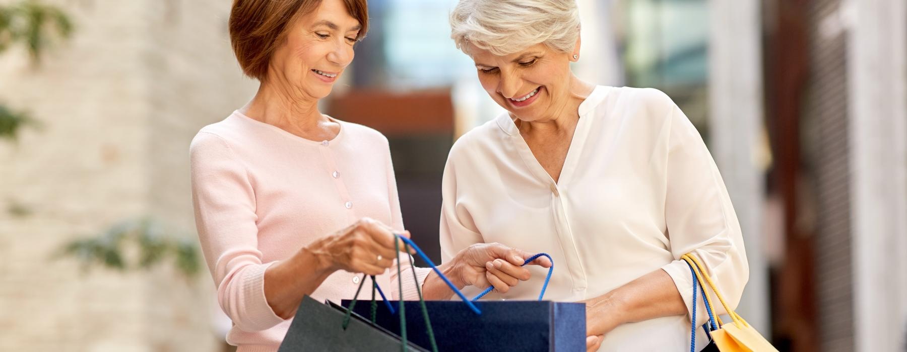 two women carrying shopping bags