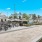 Outdoor lounge at River Rock at Shingletree 55 and over community in North Carolina, featuring bocce ball and tennis courts.