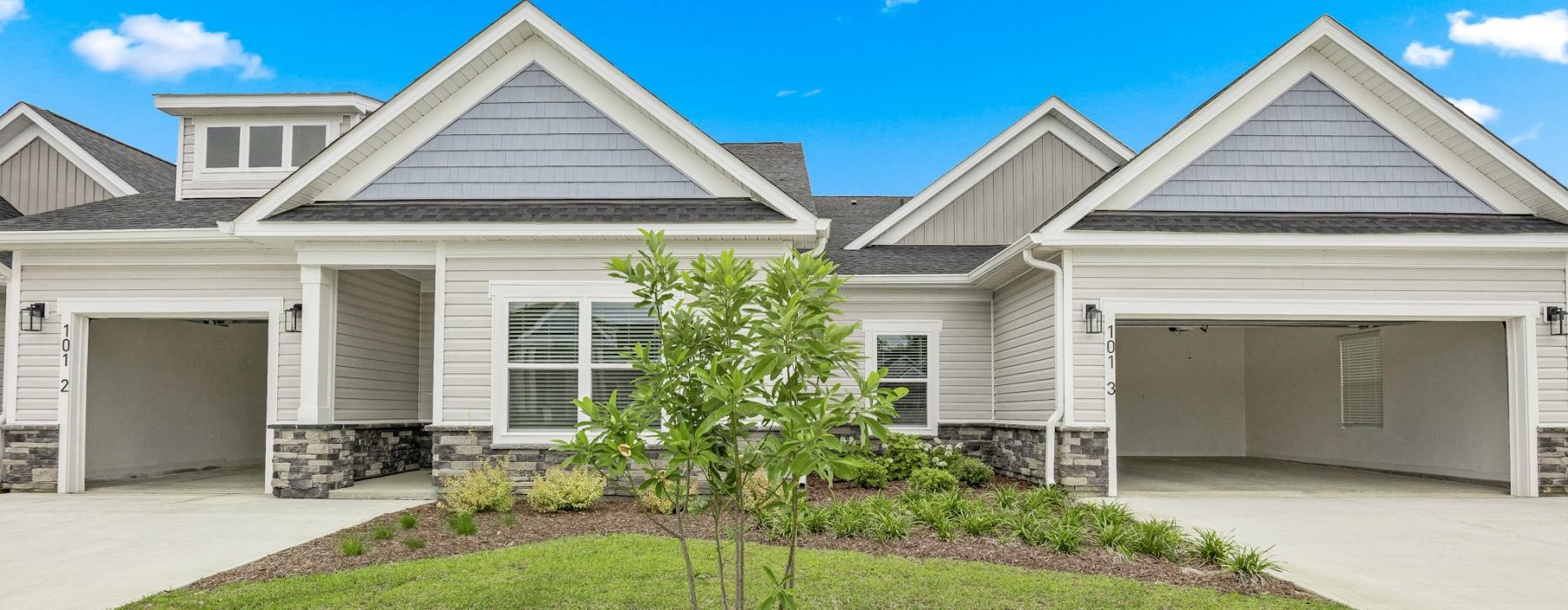 a house with a tree in the front yard