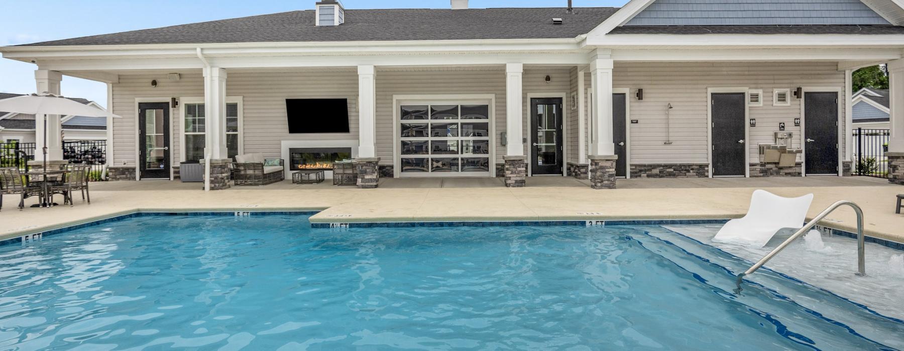 a swimming pool in front of a building