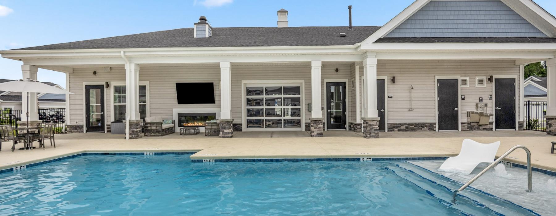 a swimming pool in front of a building