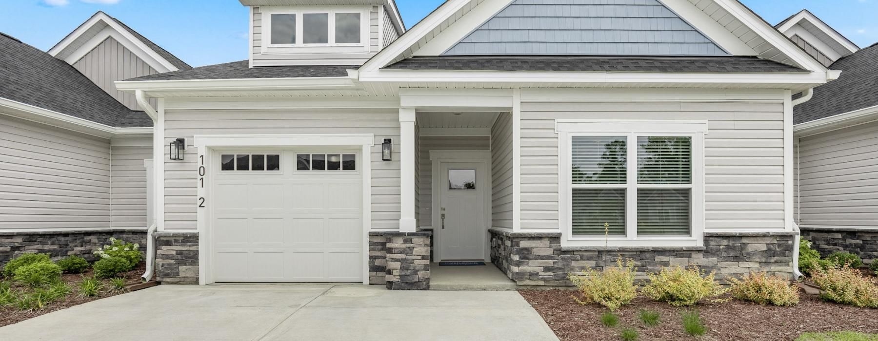 a house with garages and a driveway